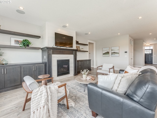 1703 S Farm View Loop, Ridgefield, WA 98642 - living area featuring light wood-style floors, a fireplace, and recessed lighting
