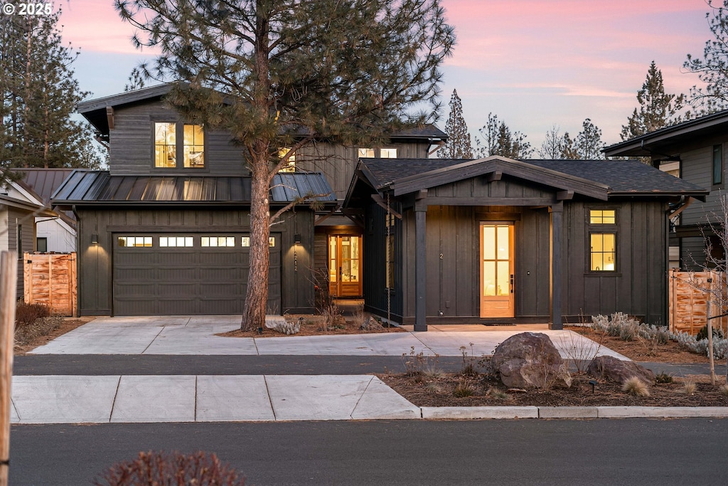 modern inspired farmhouse featuring a garage