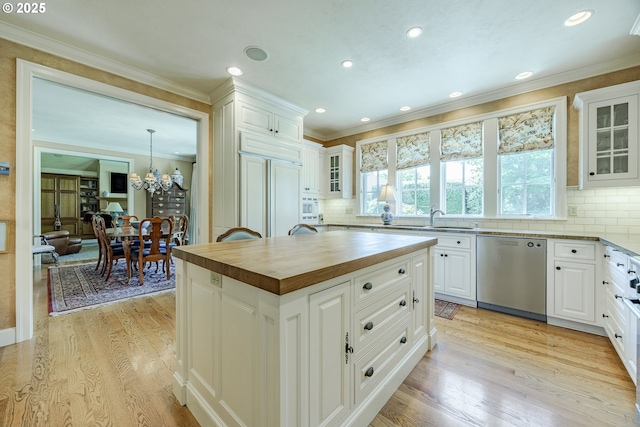 2943 Riverwalk Loop, Eugene, OR 97401 - kitchen featuring stainless steel dishwasher, wooden counters, light wood-type flooring, a sink, and crown molding