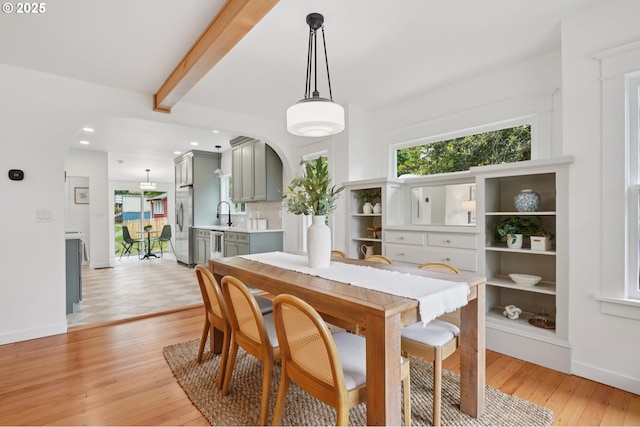 152 S Palatine Hill Rd, Portland, OR 97219 - dining space with arched walkways, light wood-style floors, beamed ceiling, and recessed lighting