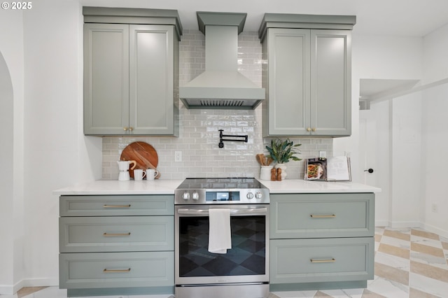 152 S Palatine Hill Rd, Portland, OR 97219 - kitchen with electric stove, wall chimney exhaust hood, gray cabinetry, and tasteful backsplash