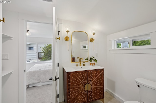 152 S Palatine Hill Rd, Portland, OR 97219 - bathroom with vanity, ensuite bathroom, and vaulted ceiling