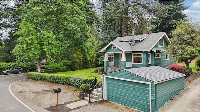 152 S Palatine Hill Rd, Portland, OR 97219 - view of front of property featuring a shingled roof, a chimney, and a garage