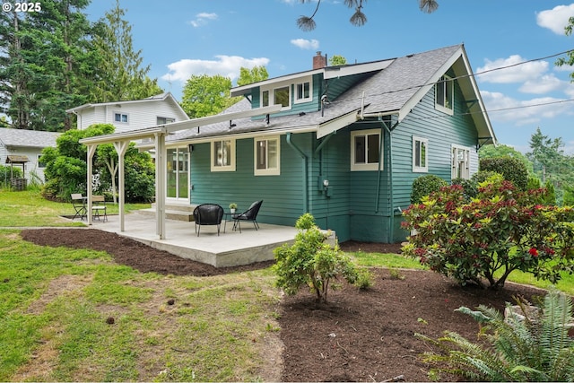 152 S Palatine Hill Rd, Portland, OR 97219 - rear view of property featuring a chimney, a patio area, a lawn, and roof with shingles