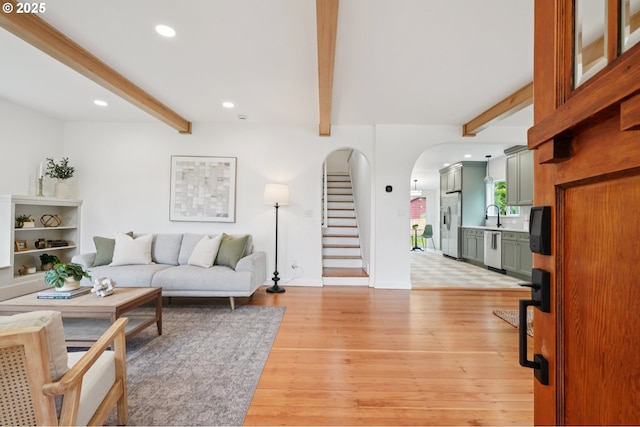 152 S Palatine Hill Rd, Portland, OR 97219 - living area featuring beam ceiling, recessed lighting, stairway, arched walkways, and light wood-style floors