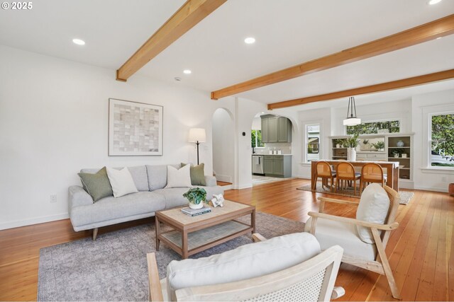 152 S Palatine Hill Rd, Portland, OR 97219 - living area featuring arched walkways, beam ceiling, light wood finished floors, and recessed lighting