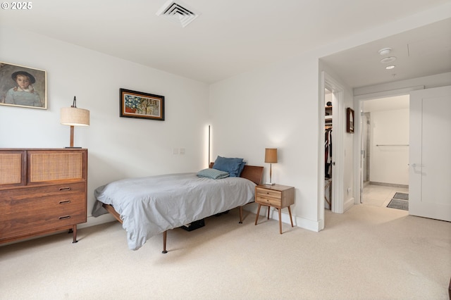 311 NW 12th Ave Unit 603, Portland, OR 97209 - carpeted bedroom featuring visible vents, baseboards, and a spacious closet