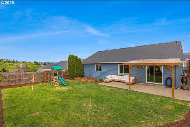 rear view of house featuring a patio, a fenced backyard, a playground, and an outdoor hangout area