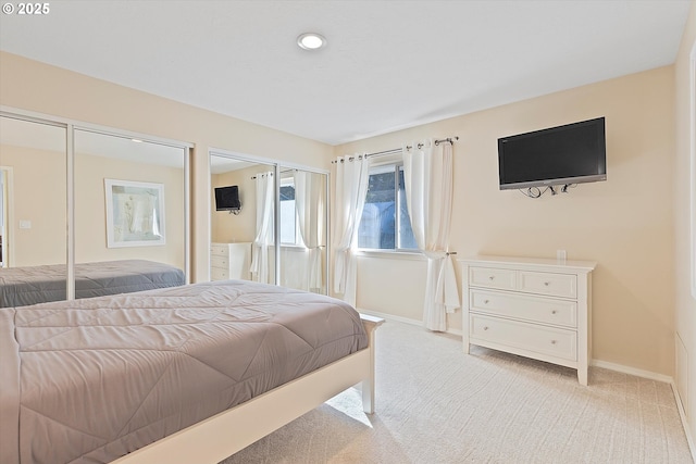 bedroom featuring light carpet