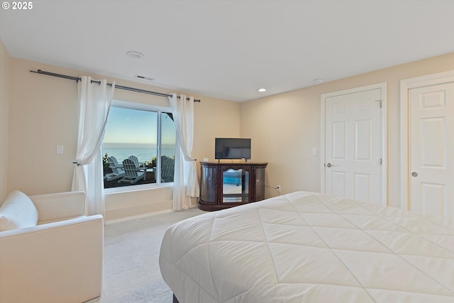 bedroom featuring light colored carpet