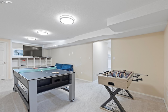 game room featuring light carpet and a textured ceiling