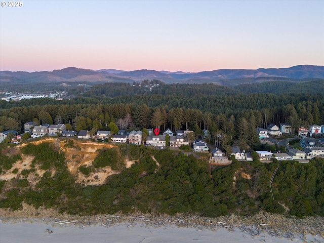 aerial view at dusk with a mountain view