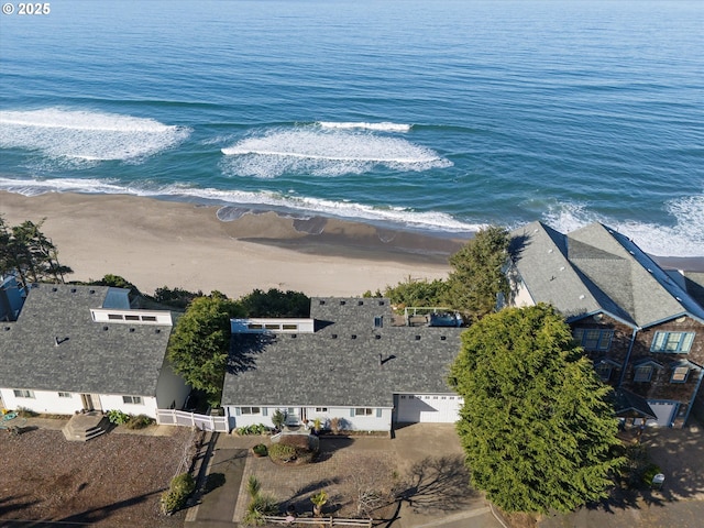 birds eye view of property with a view of the beach and a water view