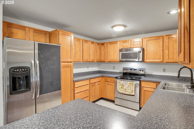 6410 SW 204th Pl, Beaverton, OR 97078 - kitchen featuring stainless steel appliances and dark countertops