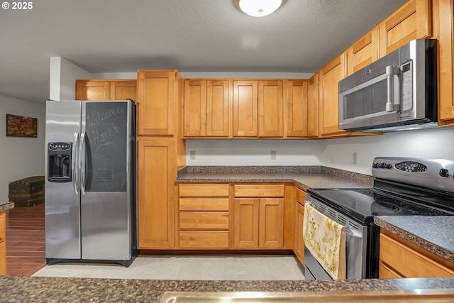 6410 SW 204th Pl, Beaverton, OR 97078 - kitchen featuring stainless steel appliances and dark countertops