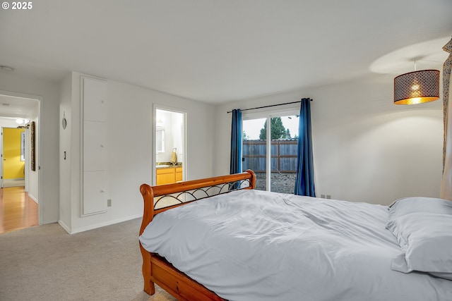 6410 SW 204th Pl, Beaverton, OR 97078 - bedroom featuring light colored carpet, access to exterior, and connected bathroom