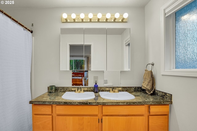 6410 SW 204th Pl, Beaverton, OR 97078 - bathroom featuring double vanity and a shower with shower curtain