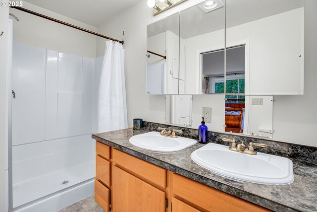 6410 SW 204th Pl, Beaverton, OR 97078 - bathroom featuring double vanity and a shower with shower curtain