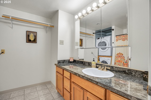 6410 SW 204th Pl, Beaverton, OR 97078 - bathroom featuring stacked washer and clothes dryer and vanity