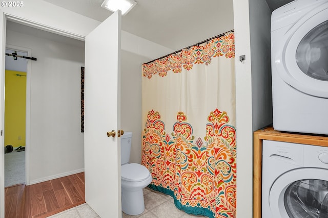 6410 SW 204th Pl, Beaverton, OR 97078 - bathroom featuring stacked washing machine and dryer and a shower with shower curtain