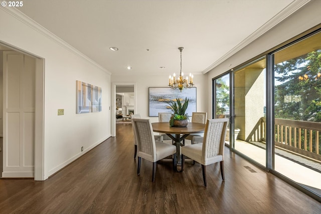 616 NW Westover Ter, Portland, OR 97210 - dining room featuring dark wood-type flooring, recessed lighting, a chandelier, crown molding, and baseboards