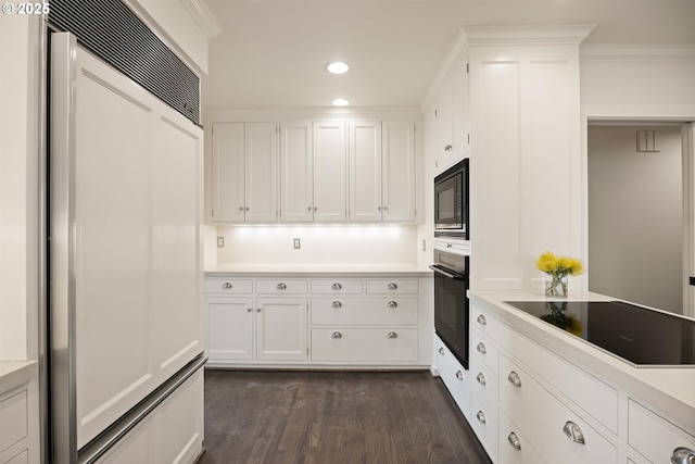 616 NW Westover Ter, Portland, OR 97210 - kitchen with black appliances, dark wood-style floors, white cabinetry, and recessed lighting