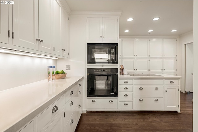 616 NW Westover Ter, Portland, OR 97210 - kitchen with black appliances, light countertops, white cabinets, dark wood-style floors, and recessed lighting