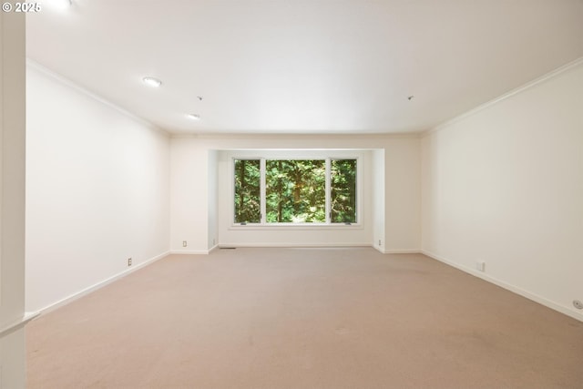 616 NW Westover Ter, Portland, OR 97210 - empty room featuring crown molding, baseboards, light carpet, and recessed lighting