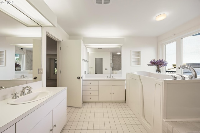 616 NW Westover Ter, Portland, OR 97210 - full bath with a garden tub, two vanities, and tile patterned flooring