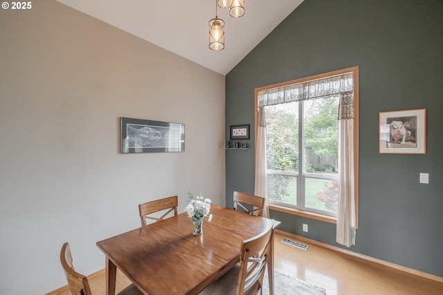 7874 Jani Ct NE, Keizer, OR 97303 - dining room featuring light wood-type flooring, high vaulted ceiling, and baseboards