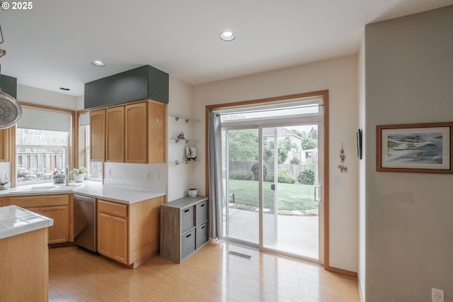 7874 Jani Ct NE, Keizer, OR 97303 - kitchen featuring stainless steel dishwasher, light wood finished floors, tile countertops, a sink, and recessed lighting