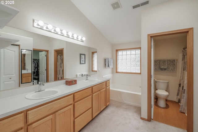 7874 Jani Ct NE, Keizer, OR 97303 - bathroom with toilet, double vanity, a garden tub, lofted ceiling, and a walk in closet