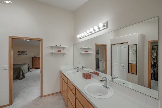 7874 Jani Ct NE, Keizer, OR 97303 - bathroom featuring double vanity, connected bathroom, and baseboards