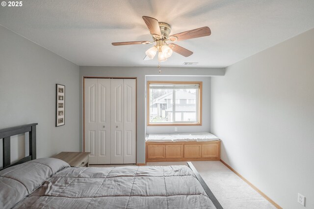 7874 Jani Ct NE, Keizer, OR 97303 - bedroom featuring light colored carpet, a closet, a ceiling fan, and baseboards