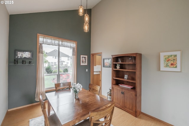 7874 Jani Ct NE, Keizer, OR 97303 - dining area with high vaulted ceiling, light wood-type flooring, and baseboards