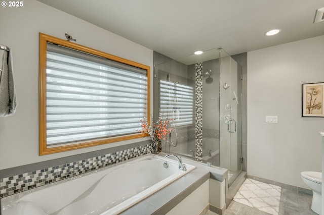 5200 NW 168th Pl, Portland, OR 97229 - full bath with a bath, a shower stall, toilet, recessed lighting, and tile patterned flooring
