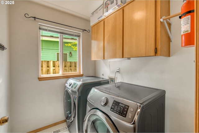 5200 NW 168th Pl, Portland, OR 97229 - laundry room with washing machine and dryer, cabinet space, and baseboards