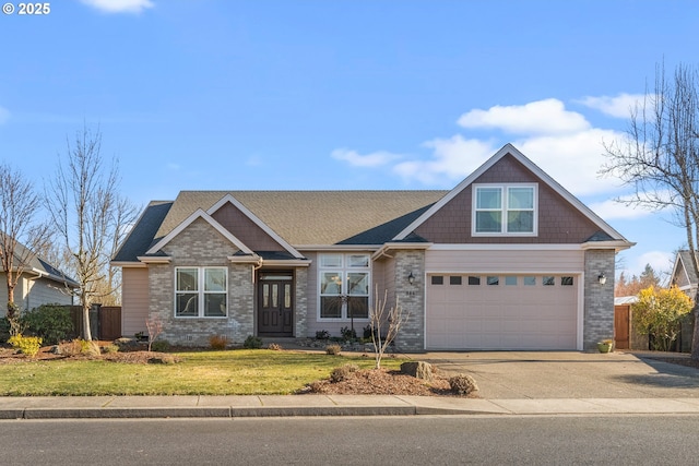 craftsman-style home featuring a garage and a front lawn