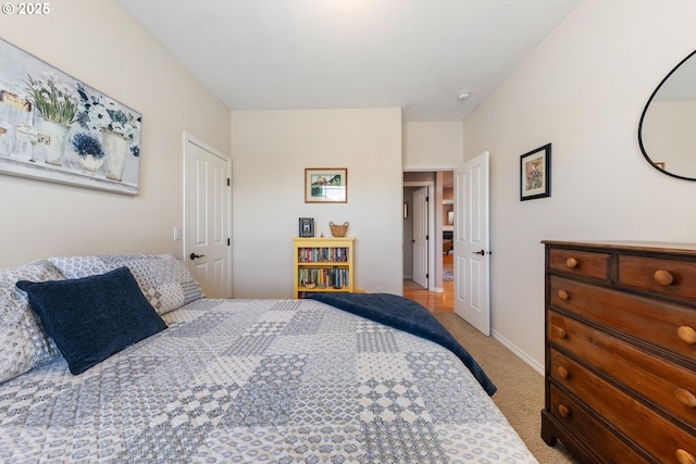 bedroom with light colored carpet