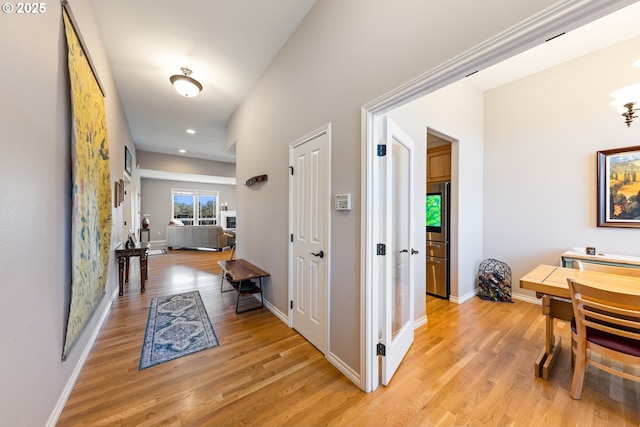 hallway with light wood-type flooring