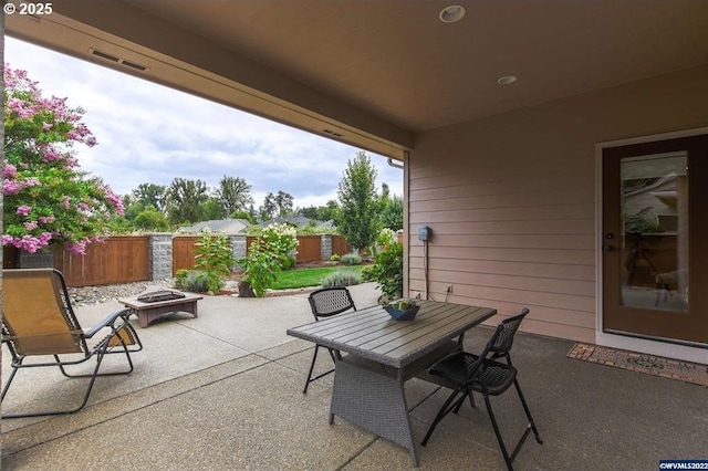 view of patio / terrace featuring an outdoor fire pit