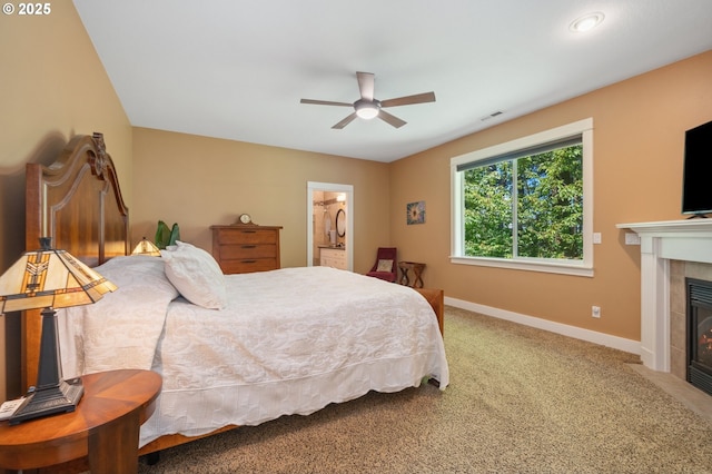 7540 SW Becky Ct, Beaverton, OR 97007 - carpeted bedroom with a tiled fireplace, baseboards, and ceiling fan