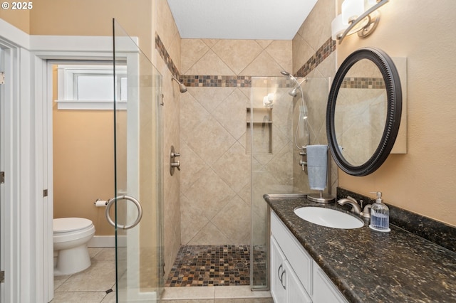 7540 SW Becky Ct, Beaverton, OR 97007 - full bath with a stall shower, vanity, toilet, and tile patterned flooring