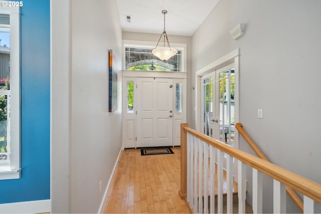 7540 SW Becky Ct, Beaverton, OR 97007 - entryway featuring baseboards and light wood-style floors
