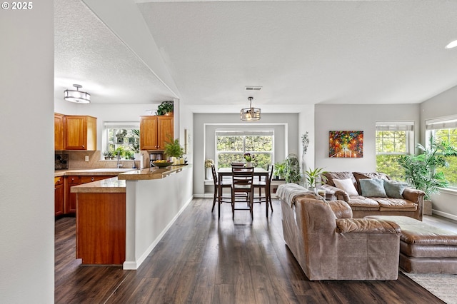 30366 SW Ruth St Unit 70, Wilsonville, OR 97070 - living area featuring baseboards, visible vents, and dark wood-style floors