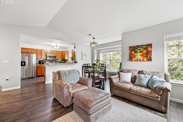 30366 SW Ruth St Unit 70, Wilsonville, OR 97070 - living room with dark wood finished floors, a wealth of natural light, vaulted ceiling, and an inviting chandelier