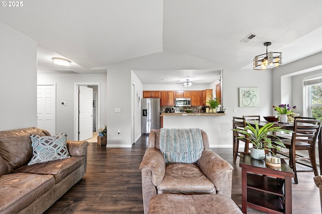 30366 SW Ruth St Unit 70, Wilsonville, OR 97070 - living area with dark wood-style flooring, a chandelier, baseboards, lofted ceiling, and visible vents