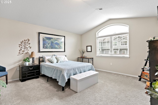 30366 SW Ruth St Unit 70, Wilsonville, OR 97070 - carpeted bedroom with baseboards, lofted ceiling, and visible vents