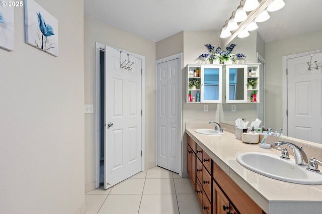 30366 SW Ruth St Unit 70, Wilsonville, OR 97070 - full bathroom featuring double vanity, a chandelier, a sink, and tile patterned flooring