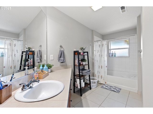full bathroom featuring visible vents, shower / tub combo with curtain, tile patterned flooring, and vanity